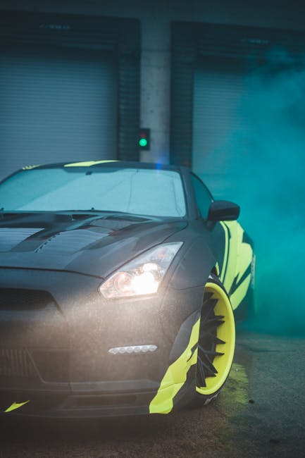 Contemporary black sports car with yellow wrapping decal design and headlight light parked on street with fume from smoke bomb near closed blinds
